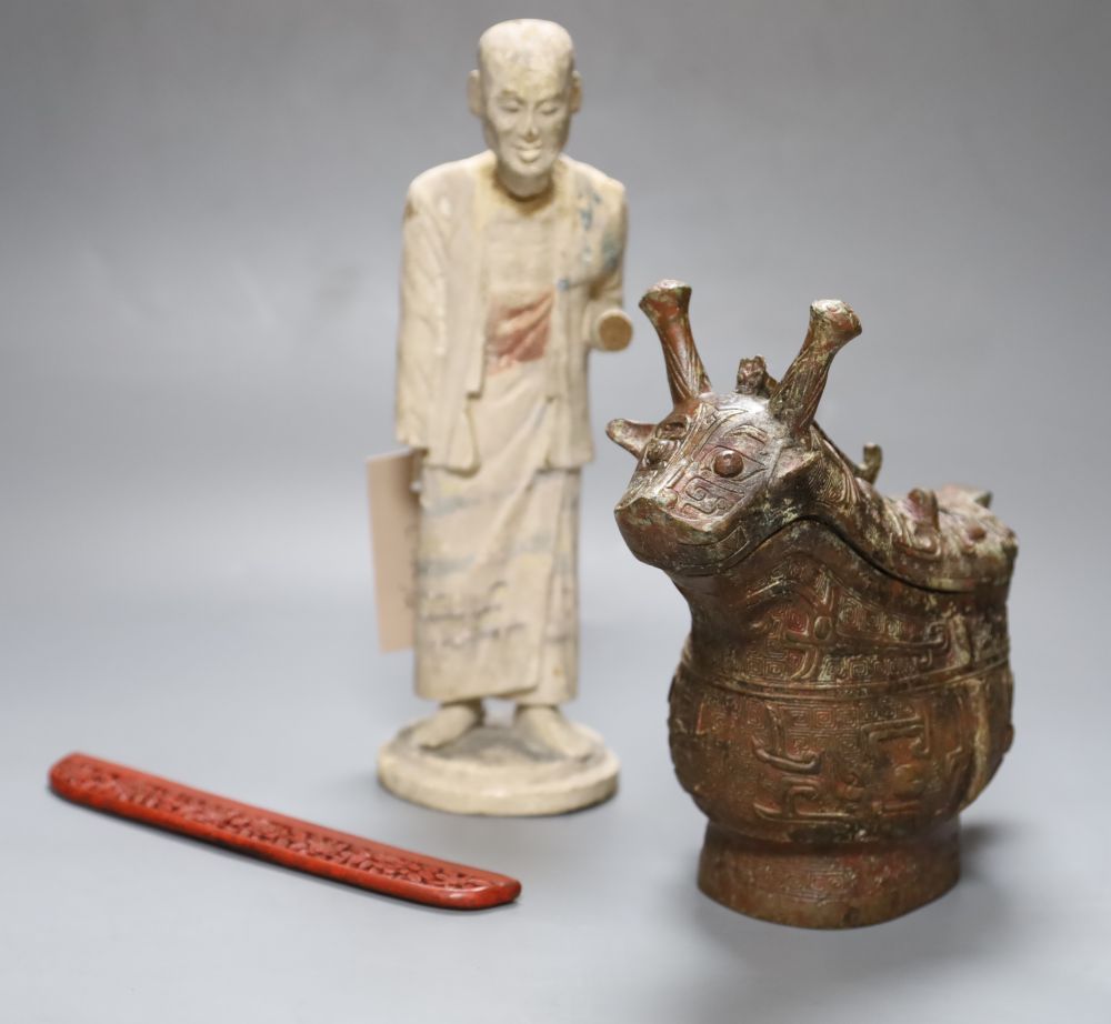 A Chinese archaistic bronze vessel, a Chinese carved wood figure and a cinnabar lacquer mount